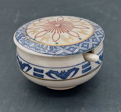 Porcelain Mustard Bowl
. Oriental, marked on the base, cylindrical body with lid and spoon 