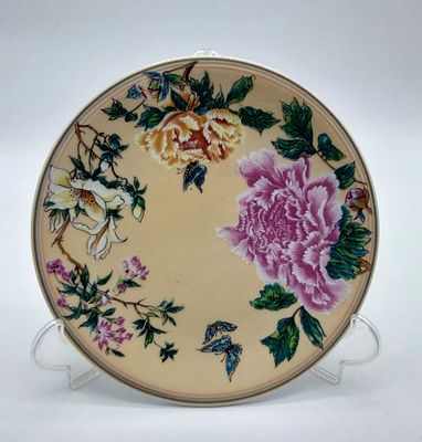 Oriental Faience Plate
. Marked at the base, edge bordered with gold and blue fillets, in the 
