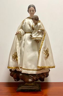 Our Lady of the Snows. Religious wooden statue of Our Lady of the Snows. 
Figure of Our Lady and 