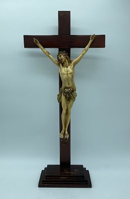 Crucifix with wooden base and cross and a polychrome painted ivory figure of Jesus Christ. The 