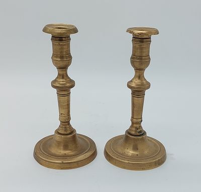 Pair of Golden Metal Candlesticks
. Cylindrical bodies with round base, carved decoration in 