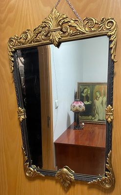 Bronze wall mirror - Empire-Style. Two-tone bronze wall mirror. 
Vertical shape of an inverted 