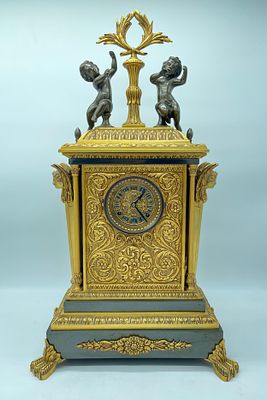 Empire-style bronze table clock. Empire style bronze table clock. Rectangular case with embossed 