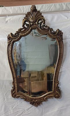 Beveled Mirror Frame
. Wooden frame with an oval shape, with relief carving and openwork 