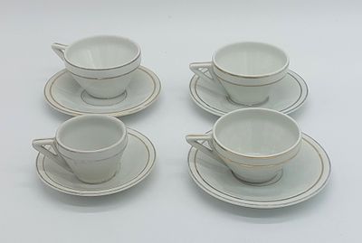 Four Cups in Portuguese Faience
. Marked on the base, Candal, three cups of tea and one of 