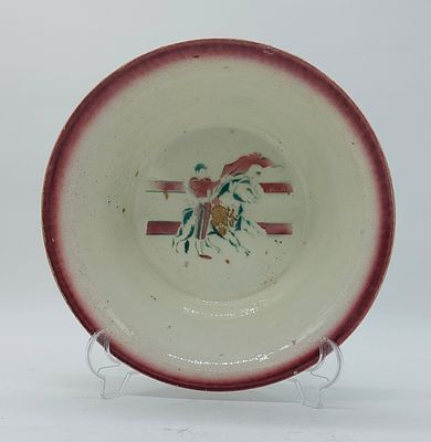 Basin in Portuguese Faience
. Edge edged in red with signs of use in the center with polychrome 