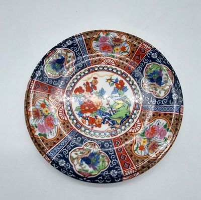Oriental Faience Plate
. Marked on the base, floral and morphological decoration in polychrome 