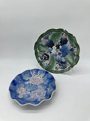 Two Plates in Oriental Porcelain
. Molded and embossed, marked on the base, wavy edge edged in 