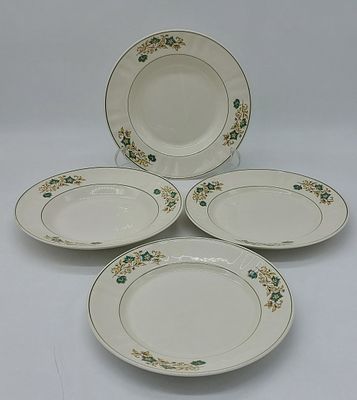 Four Portuguese Earthenware Plates
. Marked on the base Sacav&eacute;m, with green-edged rim with 