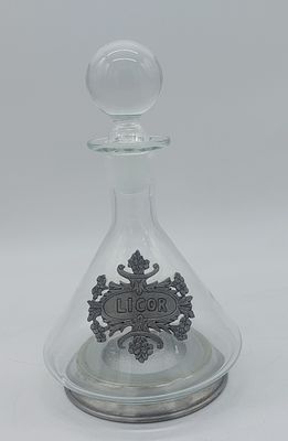 Glass Liquor Bottle
. Conical shaped body with spherical stopper, with tin applications on the 