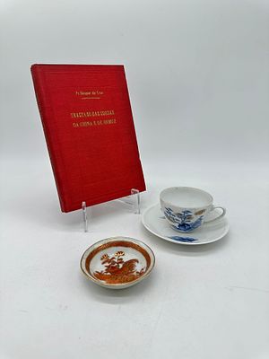 Book and Two Pieces in Oriental Porcelain
. Molded and embossed, marked on the base, coffee cup 