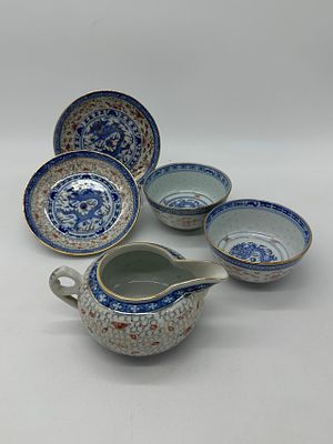 Five Pieces in Oriental Porcelain
. Molded and relief, marked on the base, milk jug and four 
