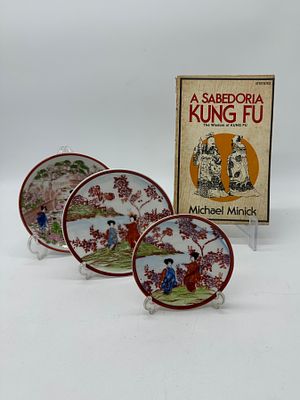 Three Porcelain Pieces and a Book
. Three dishes in oriental porcelain, molded and relief 