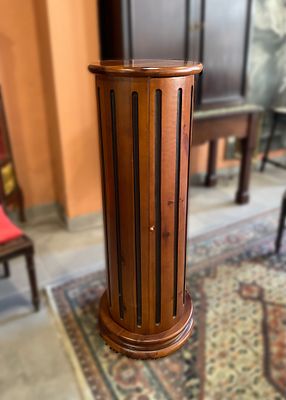 Cherry wood liquor cabinet with a cylindrical body and four shelves inside. It measures 43 x 