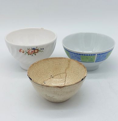 Three Earthenware Bowls
. Conical shaped bodies supported on a round base with polychrome floral 