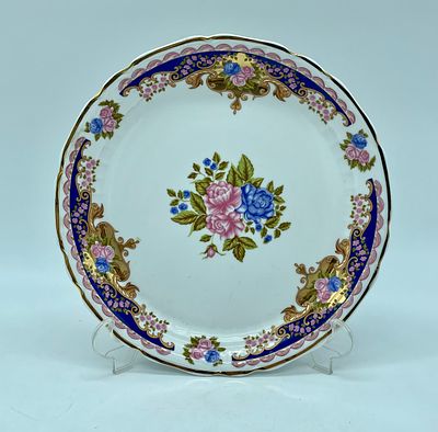 Porcelain plate. White porcelain painted with polychromatic floral motifs. Marked on the base 