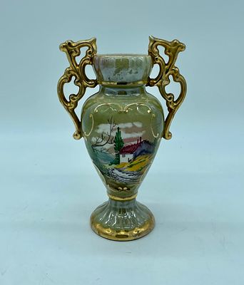 Portuguese porcelain vase. Moulded Portuguese porcelain vase. Painted green on the base with 
