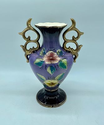 Porcelain vase. Painted porcelain vase. Purple base with polychrome painting of floral motifs. 