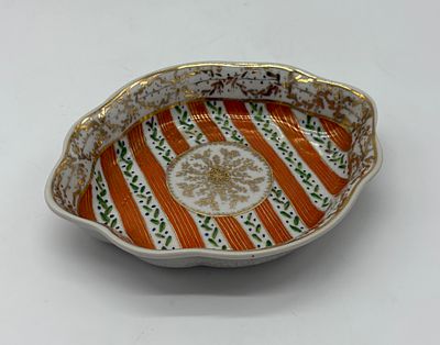 Faience plate. Moulded and embossed faience, hand-painted in polychrome with meticulous gilded 