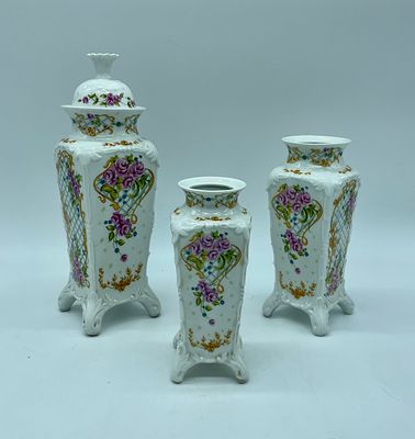 Three vases in Spanish porcelain. Moulded and relief white porcelain, painted with polychrome 