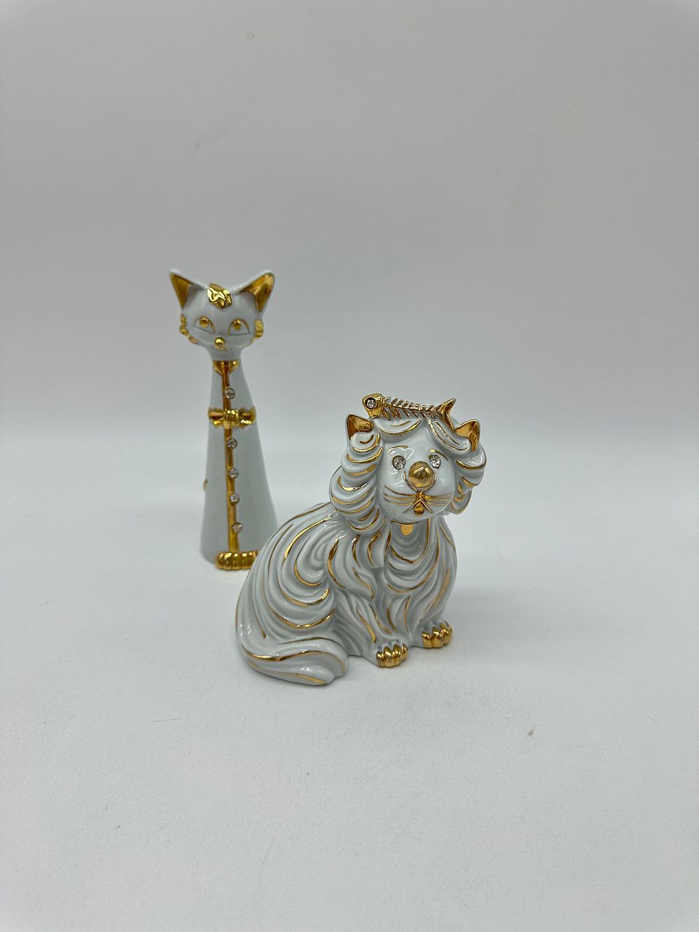 Two Porcelain Sculptures
. Molded and relief, marked on the base, Capodimonte, sculpture 