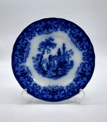 Faience Plate
. Marked on the base, Athens, scalloped edge and bordered in blue with floral and 