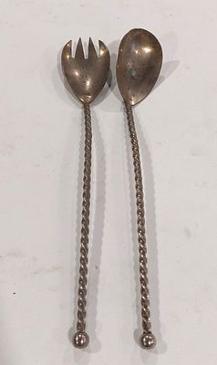 Two Silver-Plated Metal Serving Utensils. Silver-plated metal bodies with twisted cables and 
