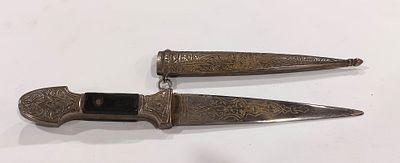 Decorative Dagger
. Decorative silver-plated metal dagger with wooden handle, blade and sheath 