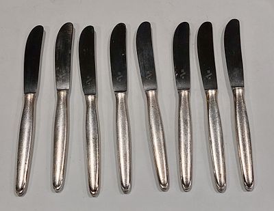 Eight WMF 90-27 Meat Knives
. Silver-plated metal bodies, marked, brushed metal, with signs of 