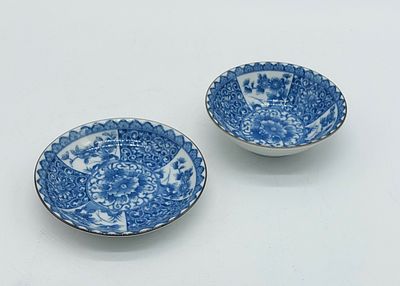 Porcelain Cup and Plate
. Molded and embossed, with a gilded rim and monochrome floral 