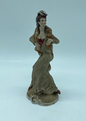 Porcelain statuette. Moulded and relief porcelain statuette with polychrome painting. Depicting 