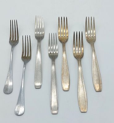 Seven Silver Metal Forks. Silver-plated metal bodies, assorted models, with signs of use as seen 
