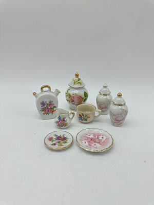 Eight Porcelain Miniatures
. Molded and embossed, marked on the base, various shapes and forms 