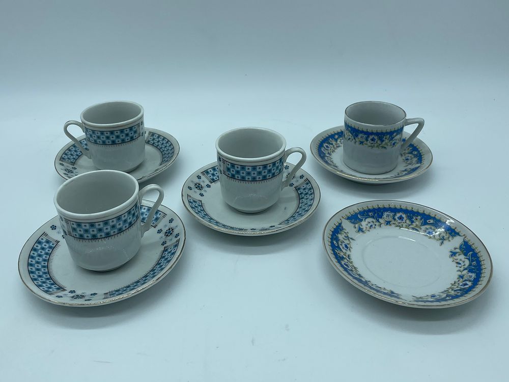 Four Porcelain Coffee Cups
. Cylindrical-shaped bodies with polychrome floral decoration on a 