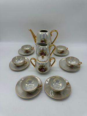 Coffee Service in Portuguese Porcelain
. Molded and relief, marked on the base, Viana, teapot 