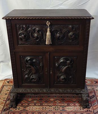 Renaissance Bar Furniture
. Solid chestnut wood, with upper hinged door and two lower doors 
