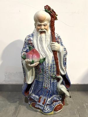 Oriental Porcelain Sculpture
. Sculpture representing Chinese Immortal, in molded and relief 