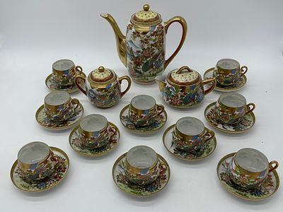 Oriental Porcelain Coffee Service
. Molded and relief, teapot, sugar bowl, milk jug and ten cups 