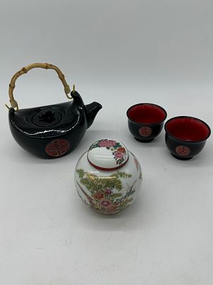 Kettle with Two Bowls and Pot
. Kettle with straw handle, metal lid and strainer, with two bowls 