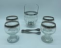 Ice Bucket and Four Glass Cups
. Ice bucket and four glass tumblers. Cylindrical bodies, ice Image - 1