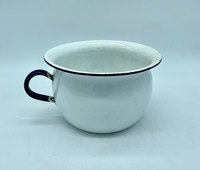 Rare enamel potty. Bowl-shaped body with handle. Details painted in dark blue on a white 