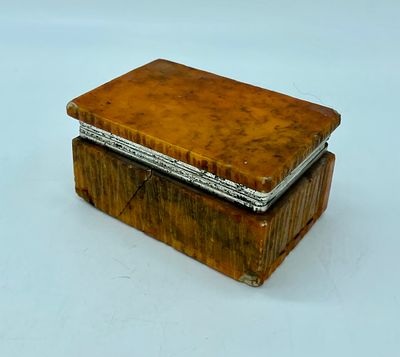 Alabaster box. Orange-coloured textured alabaster box with metal appliqu&eacute; in the opening area. 