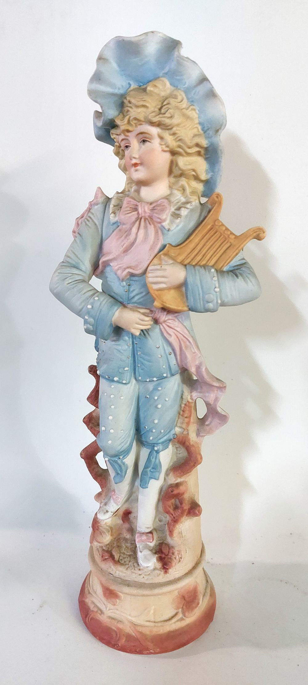 Biscuit Sculpture. European, representing an ancient lady, polychrome decoration, on a round 