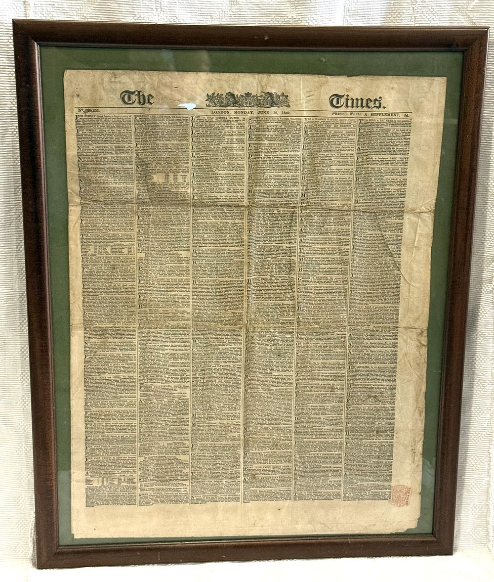 Framed The Times Newspaper
. Square-shaped body, wooden frame, with a newspaper page from The 