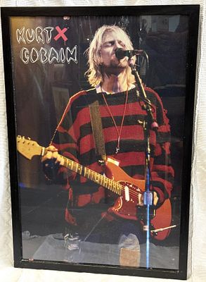 Framed Kurt Cobain Poster
. Rectangular body, black wooden frame, poster with slight signs of 
