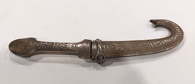 Curved Decorative Dagger. Decorative dagger, curved body in silver-plated metal with handle 