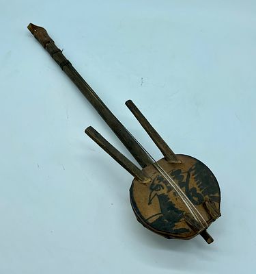 Kora musical instrument from West Africa. Wooden body with hand-painted leather parts and 