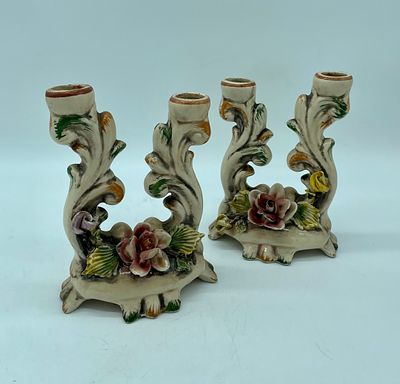 Pair of faience candlesticks. Pair of moulded and relief european faience candlesticks with 