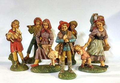 Seven Sculptures in Italian Faience
. Earthenware sculptures representing men and women on a 