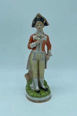 Porcelain Sculpture of a Man
. Molded and relief, representing Man resting on a round base with 